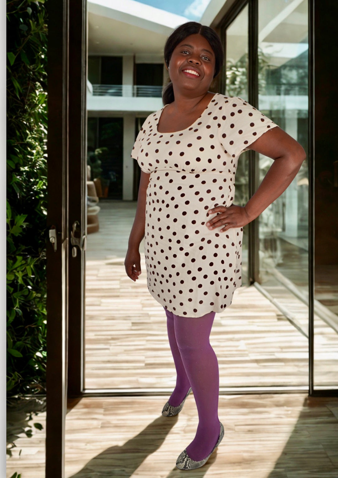 Orchid Whim purple polka dot tights styled with a cream spot dress
